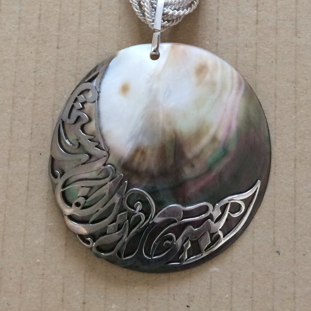 - 26 cms long necklace with circular pendant off white
